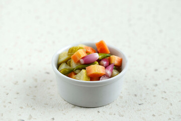 Acar, Side Dish for Chicken, Meat, or Martabak Dish. Diced Carrot and Cucumber with Green Chilli and Shallot, Mix with Vinegar, Sugar, Salt.