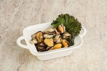 Tasty marinated mussels in the bowl