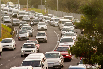 Traffic, the last thing you need after work. Shot of a cars traveling in heavy traffic on the way home from work. - obrazy, fototapety, plakaty