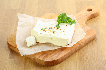 Greek Feta cheese over board