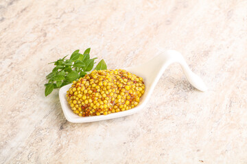 Grain mustard sauce in the bowl