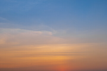 Fototapeta na wymiar Beautiful orange sunset sky background. Evening sky a bright golden.