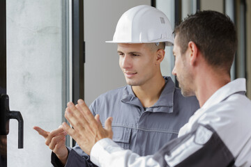 men and window installation worker