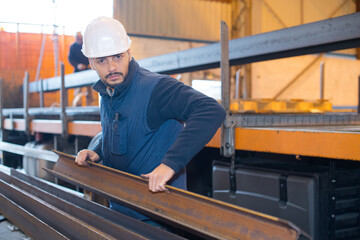 man lifting rsj in factory