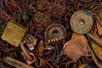 Fototapeta na wymiar Close-up of copper waste in the form of copper wires, coils and transformers in a landfill.
