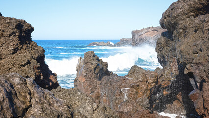 Fototapeta na wymiar Huge waves crashing on the coast of Lanzarote