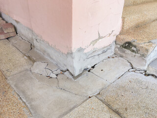 Collapsed or cracked concrete basement floor and pole