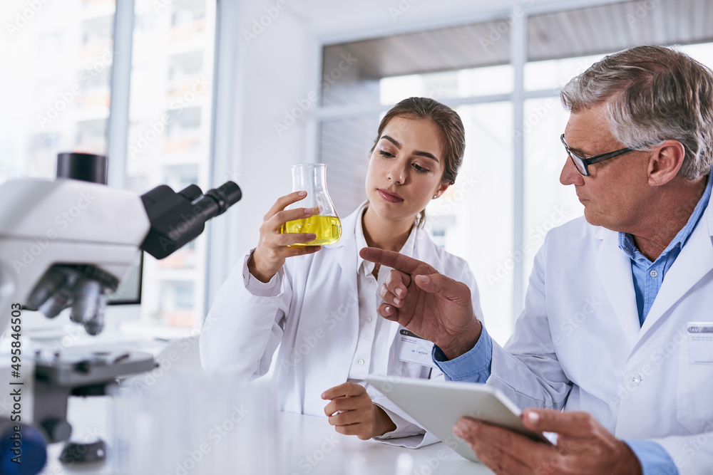 Aufkleber Backing up their strong claims with strong evidence. Shot of two scientists conducting an experiment together in a lab.