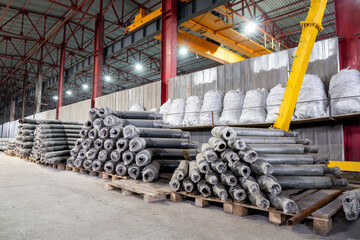 Piping accessories. Thermally insulated metal pipes covered with plastic and galvanized sheath are stacked in a warehouse.