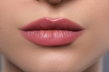 Young woman with beautiful plump lips, closeup