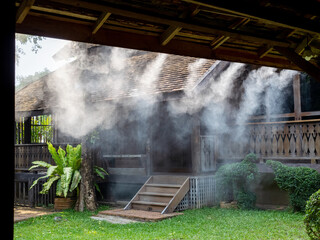Cooler cooling system for cooling water and reducing air pollution. on roof thai house