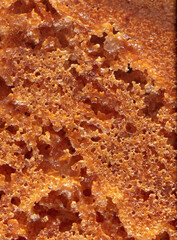 Crust on ruddy cookies as an abstract background.