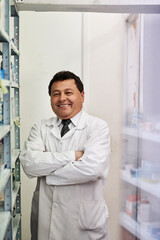 Naklejka na ściany i meble For all your prescription needs. Portrait of a male pharmacist in a pharmacy.
