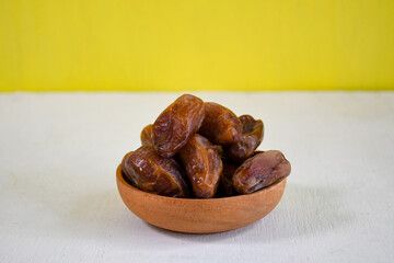 dried dates fruit in a bowl for ifthar ramadhan and ied fitr