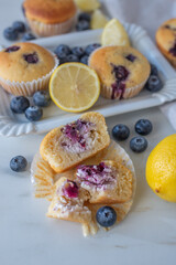 Freshly baked blueberry ricotta muffins with lemon