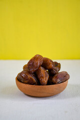 dried dates on wooden table. Wallpaper Ramadhan