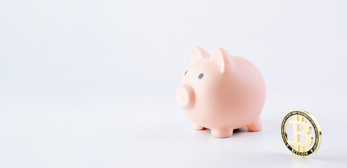Save currency bitcoin. Pink pig bank with golden bit coin money BTC on white background. Save money investment and business finance.
