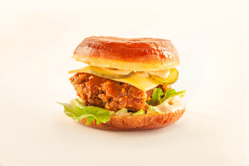 Donut burger bun with fried chicken patty melted cheese and dressing