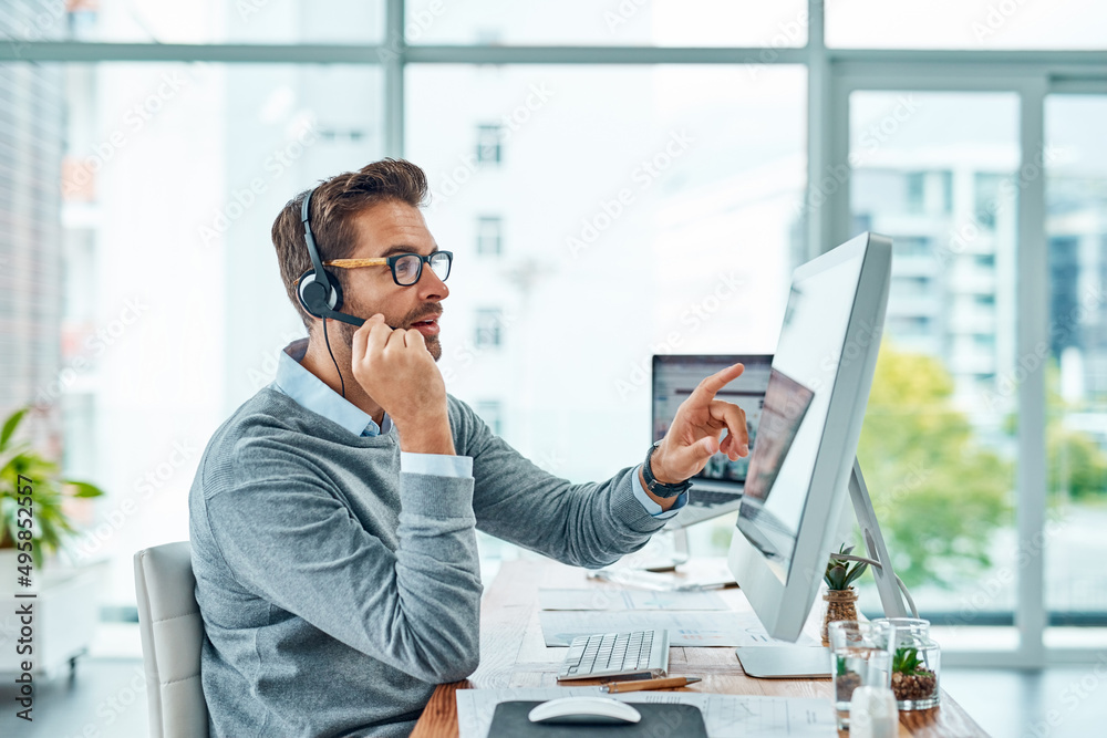 Aufkleber Let me take you through the process step-by-step. Shot of a young call centre agent working in an office.