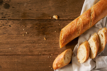 fresh homemade baguette on a wooden background