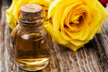 Bottles of essential rose oil for aromatherapy.