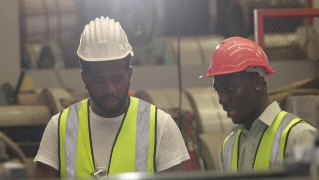african black engineer staff foreman training talk job process explain to new staff worker.
