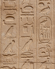 Ancient Egyptian murals and writings on the stone walls of the Karnak Temple in Luxor