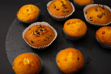 Juicy cupcakes on a black background, confectionery, bakery
