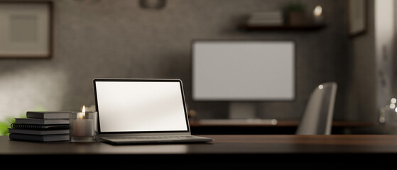 Obraz na płótnie Canvas Dark wood tabletop workspace with notebook laptop and copy space