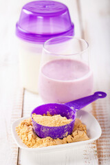 Protein and milk for milkshake. Sports food. Selective focus.