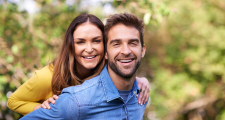 Be with someone who makes you laugh. Portrait of a happy young couple spending time together outside.