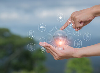 Light bulb Energy saving green nature background