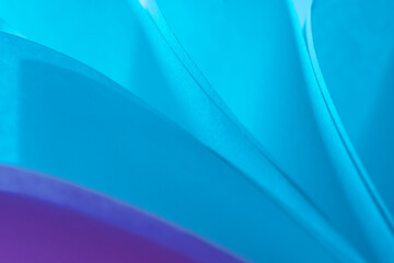 colorful abstract wallpaper texture. background macro of origami pattern made of curved sheets of...