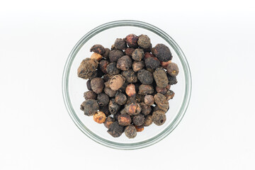 Dried Brown Jamun Gutli(Indian Blackberry Kernels) over isolated white Topview