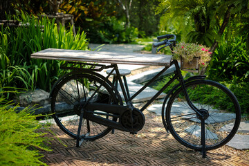 Fototapeta na wymiar Vintage Bicycle is parked in the Garden