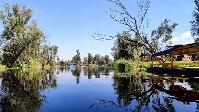 timelapse at xochimilco with abandoned trajinera at the view