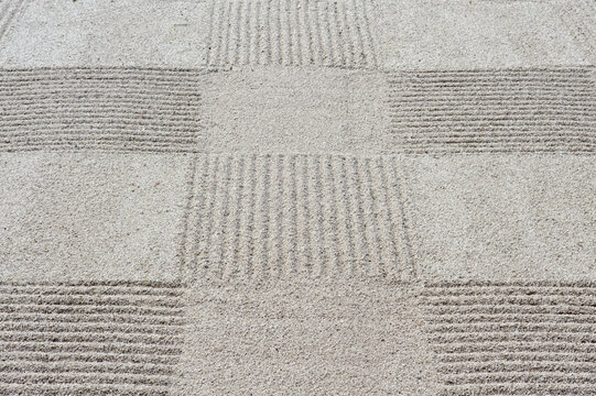 Grid pattern of raked gravel at a temple