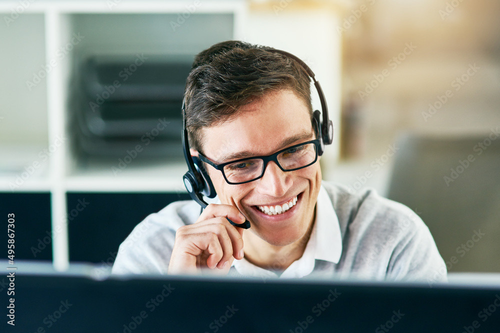 Canvas Prints He handles every call with utmost professionalism. Shot of a young call center agent working in an office.