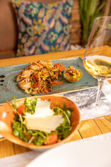 Arugula tomato salad with shaved parmesan cheese