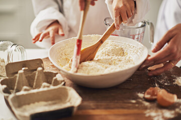Fototapeta premium Lets get cooking. Cropped shot of a mother and her son baking in the kitchen.