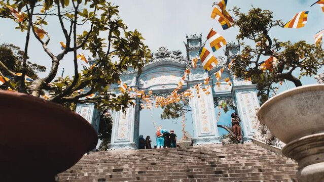 slowly moving up the stairs between the flowerpots in Ba Na Hills, Vietnam
