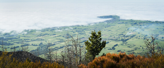 Panorama view from Mt Fyffe track, clouds drifting over Kaikoura peninsula, South Island, New Zealand