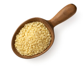 Raw hemp seeds in the wooden spoon, isolated on the white background, top view.