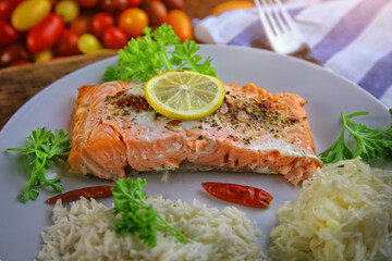 delicious and healthy baked salmon with rice and salad
