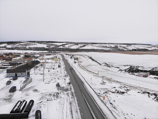 Winter road with construction work going on, Krasnoyarsk, Siberia
