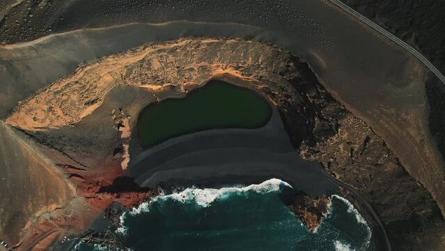 Beautiful drone point of view volcanic green lake or El Lago Verde, Charco de los Clicos viewpoint in El Golfo. Lanzarote. Canary Islands. Spain. Famous places and landmark, travel destination concept
