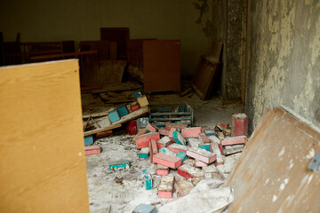 Broken, destroyd, abandoned kindergarten in Chernobyl Exclusion Zone, Lost toys, A broken plastic doll,  Ukraine, ghost town Pripyat..