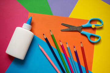 set for application - colorful paper, pencils, glue, scissors