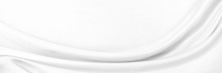 White gray satin texture that is white silver fabric silk background with beautiful soft blur pattern natural.