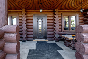 wooden doors to a country house in the form of a log house